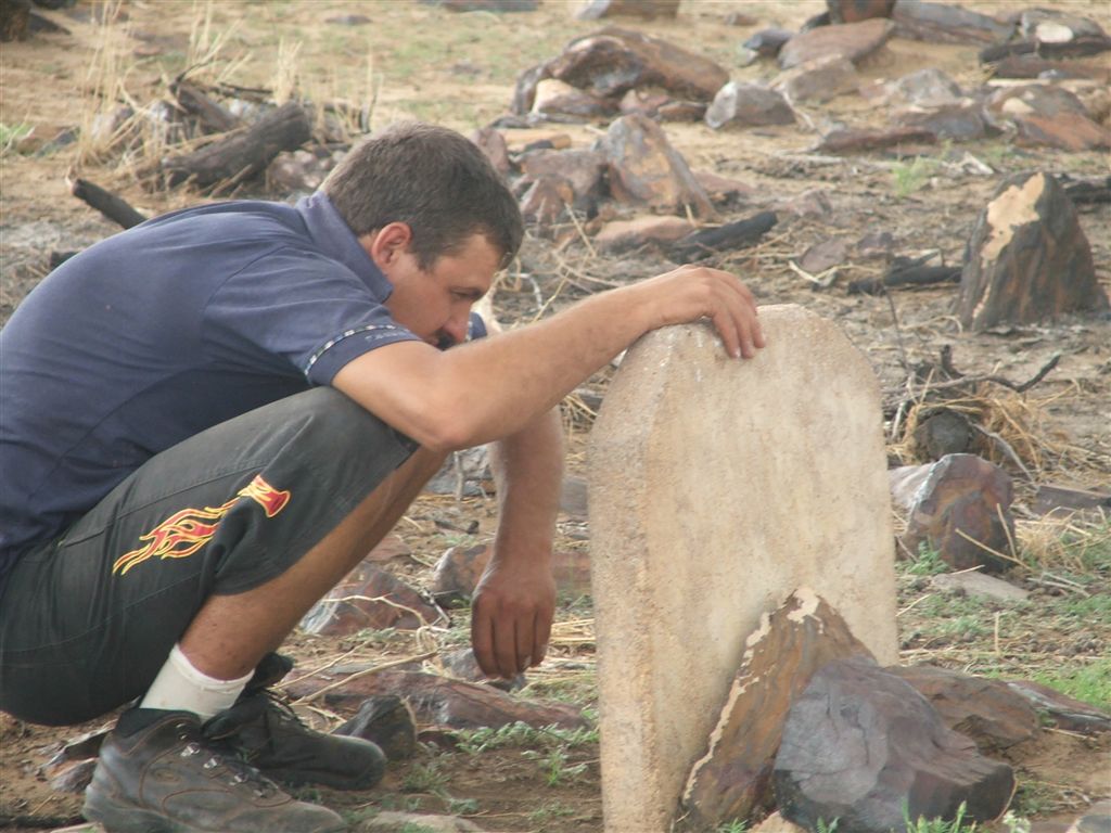 3. Willie Karsten trying to decipher the gravestone
